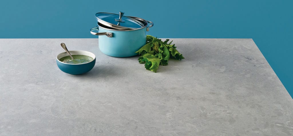 Grey quartz countertop with pot and bowl of soup 